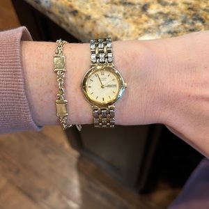 citizen quartz two toned silver and gold round face watch